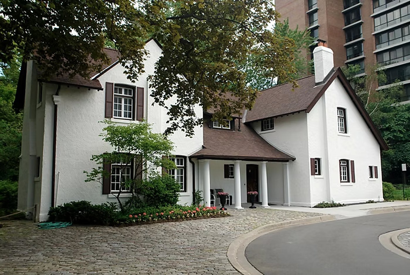 McMaster House, a white stuccoed 1911 residence with dark shutters, on the Fairways grounds