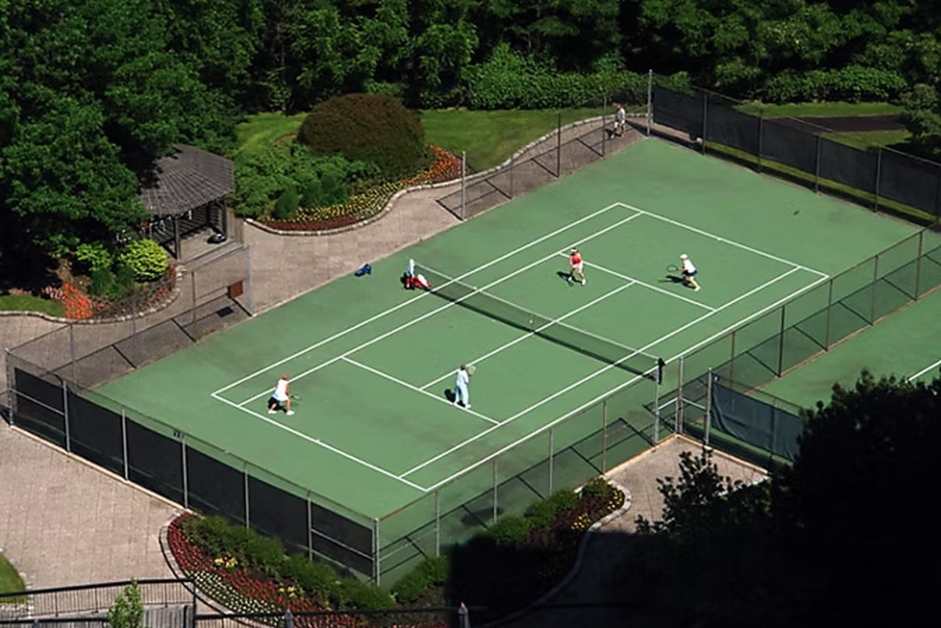 Residents playing on the private tennis court, seen from above